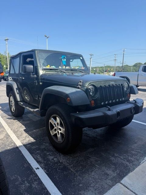 2011 Jeep Wrangler Sport in Natural Green Pearlcoat — front three-quarter view