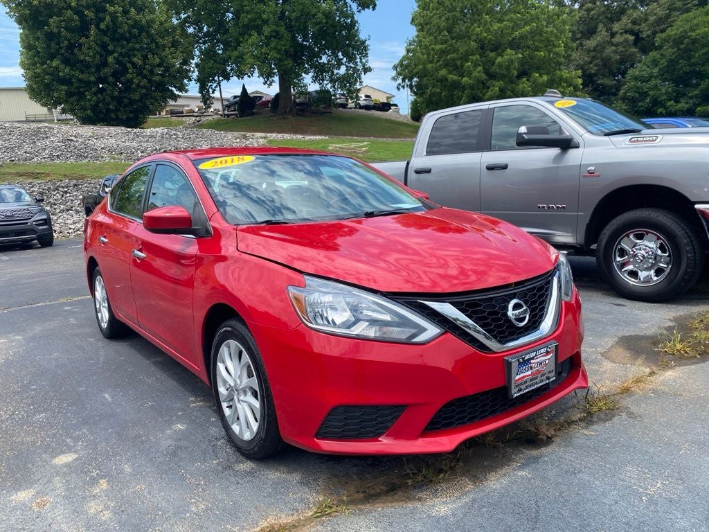 2018 Nissan Sentra SV in Red Alert — front three-quarter view